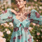 Damenbluse mit Blumenmuster, quadratischem Ausschnitt und geknoteter Vorderseite